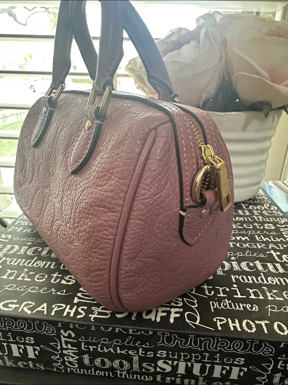 Coach mini Rowan signature leather in the color peony